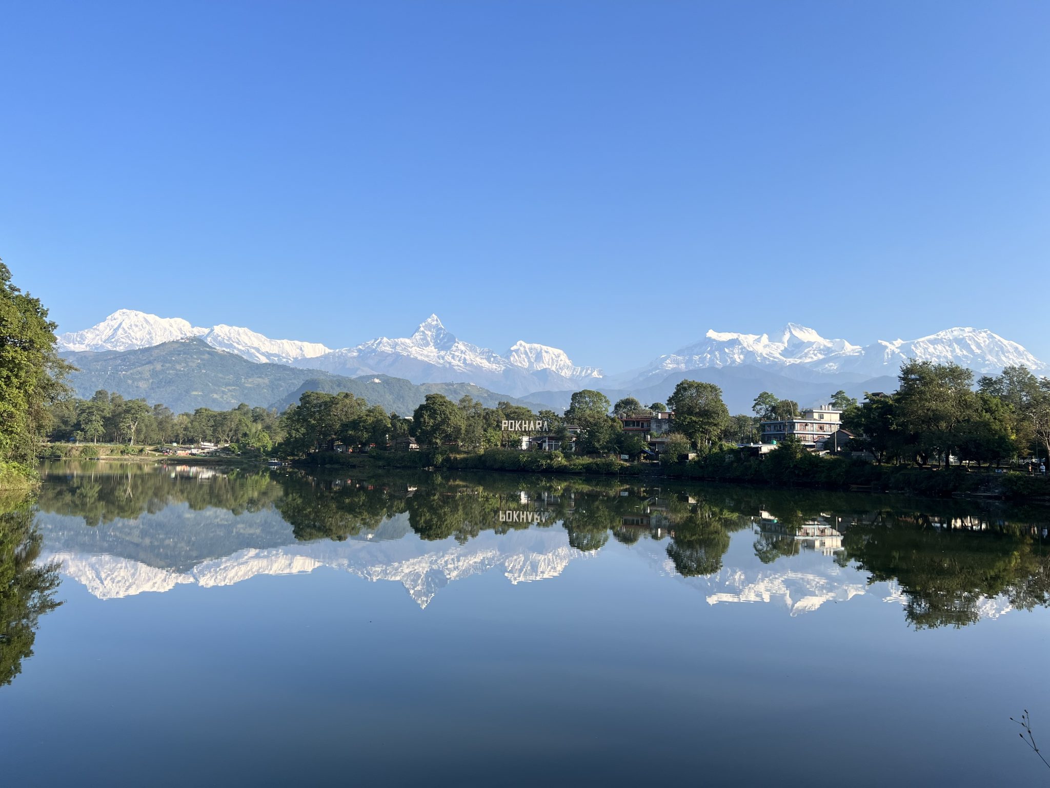 Annapurna range reflected on Phewa Lake, Pokhara, Nepal