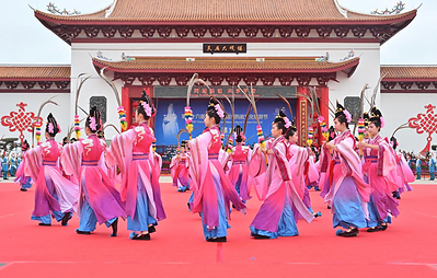 Performers in traditional costume at a Mazu temple ceremony