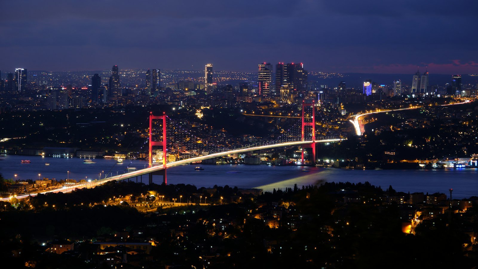 Bosphorus bridge and Istanbul skyline at night
