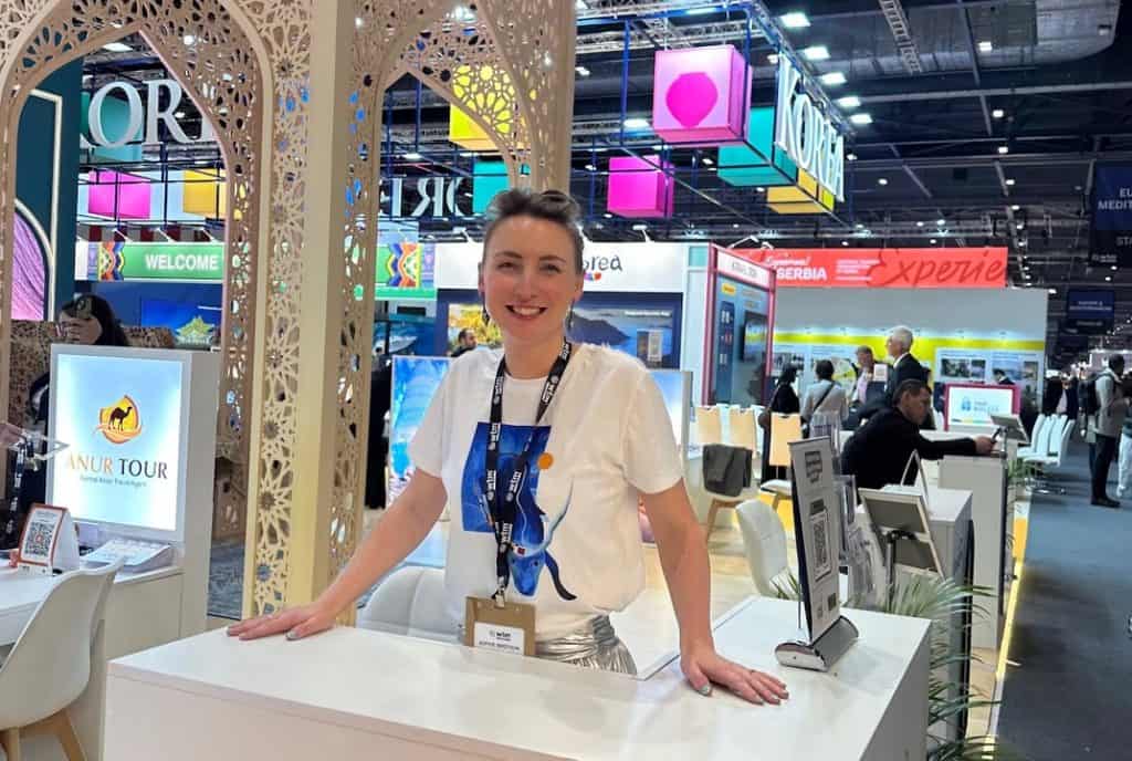 Sophie Ibbotson, founder of Maximum Exposure, at a travel trade show stand