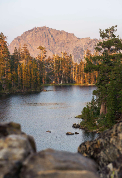 Alpine lake and granite peak at sunset near South Lake Tahoe, California